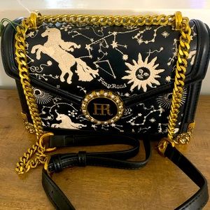 Black unicorn embroidered shoulder bag.